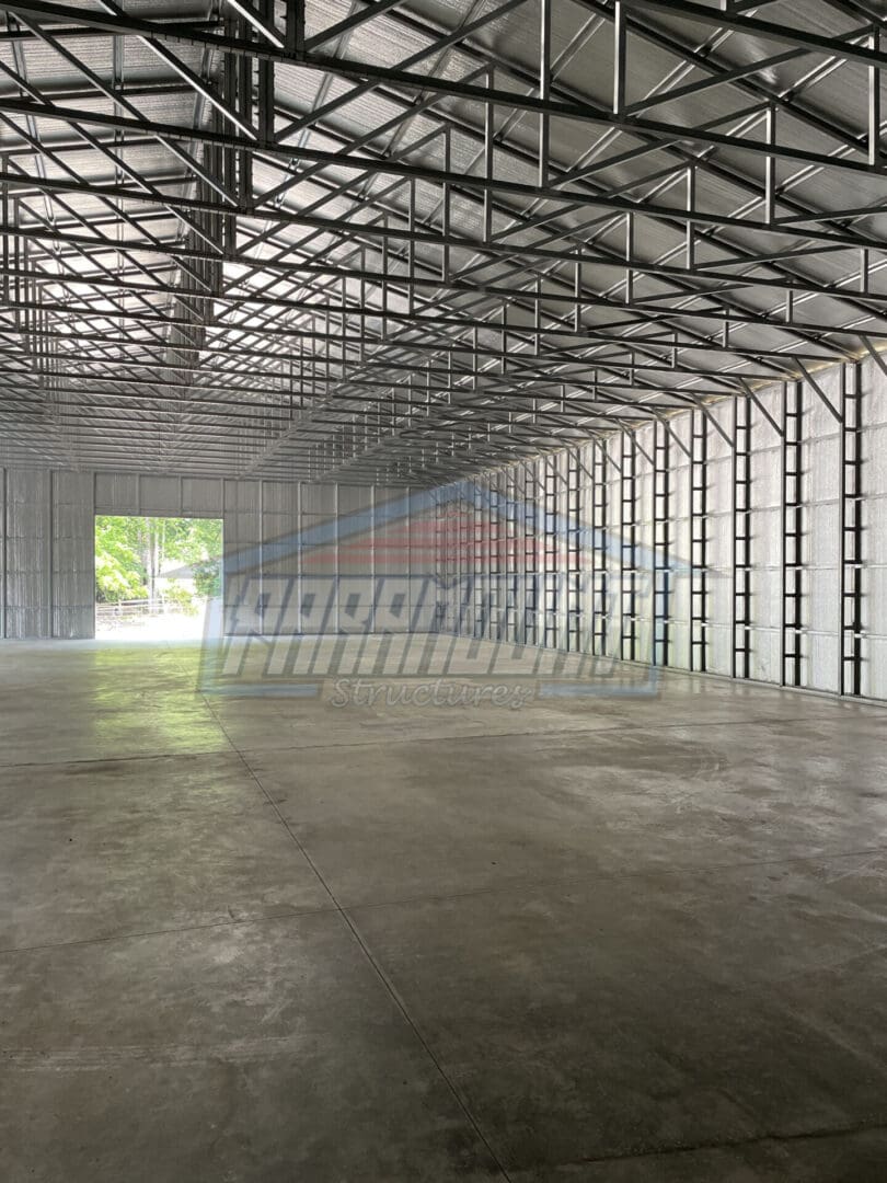 A large warehouse with lots of windows and doors.