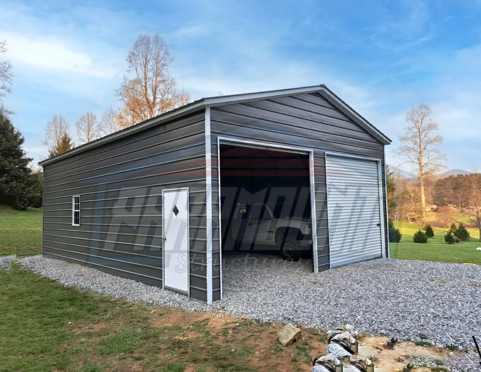 A garage with two doors and a door that has been opened.