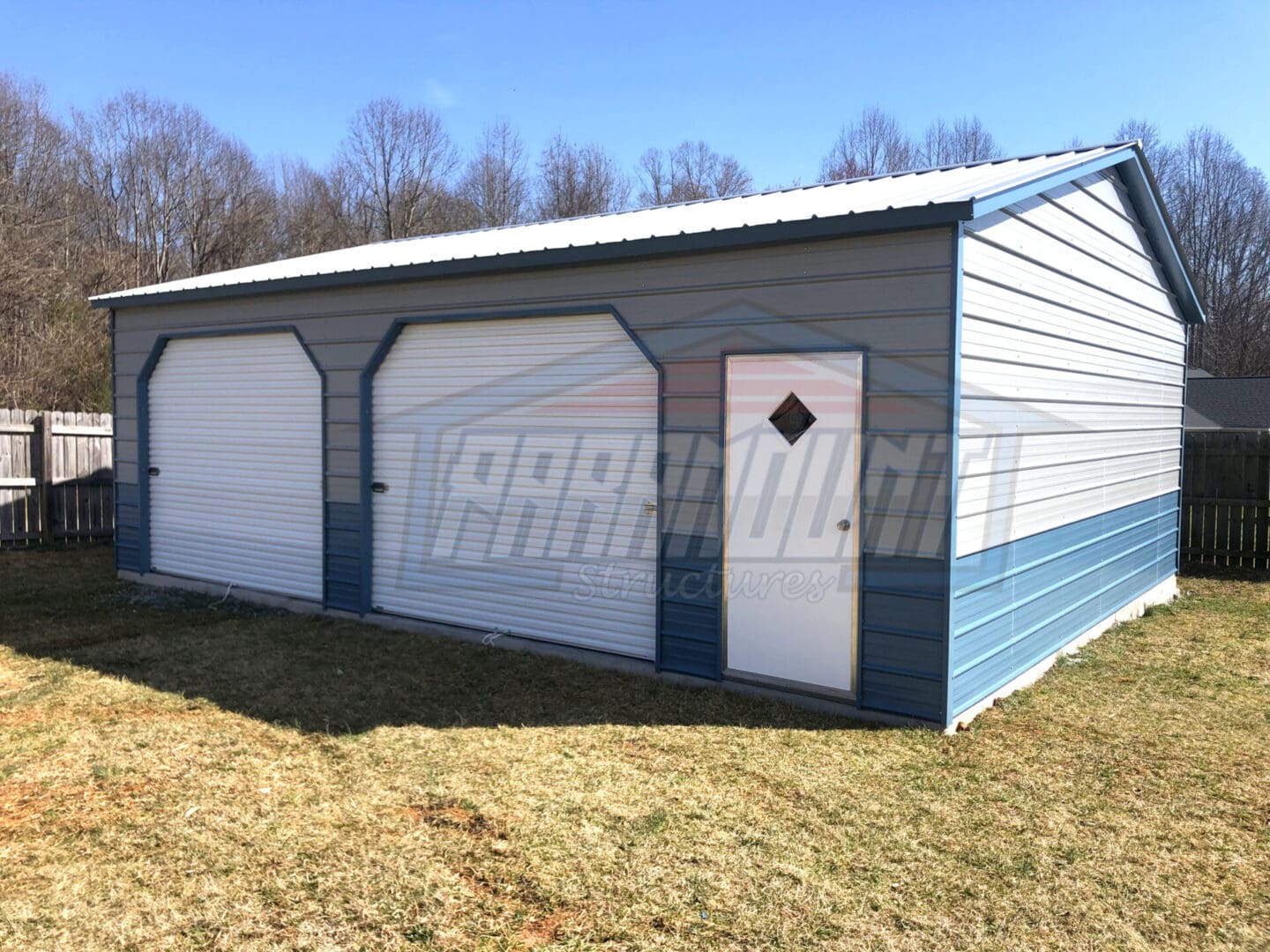A blue and white garage with two doors.
