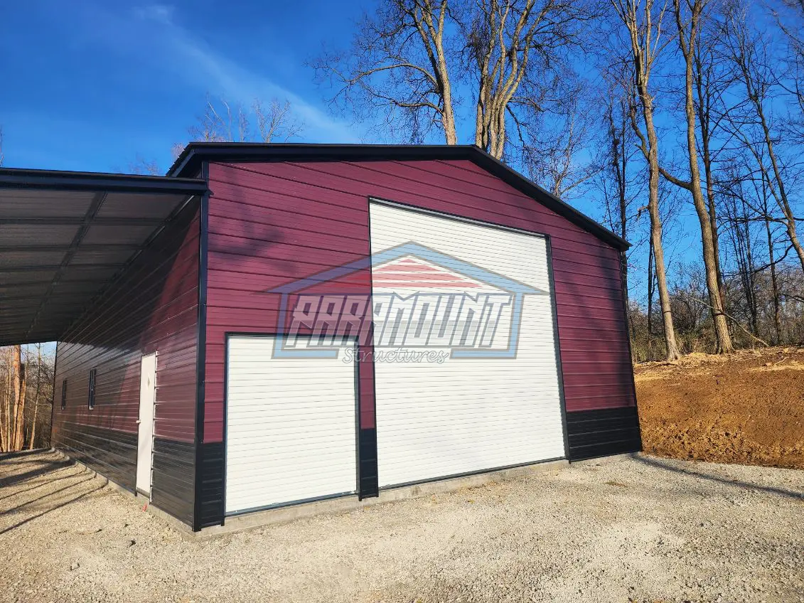 A metal barn with two garage doors.