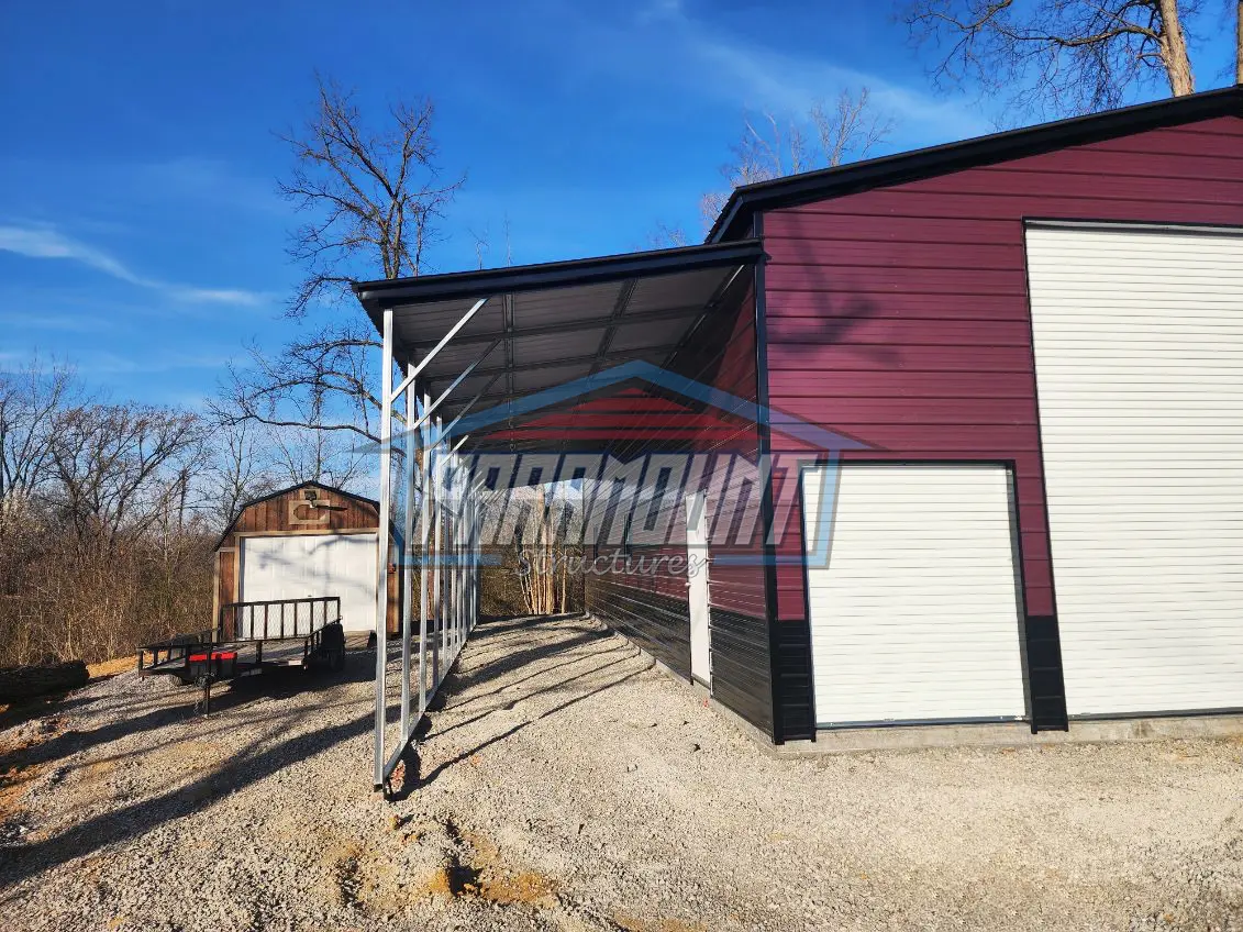 A metal carport attached to a metal garage.