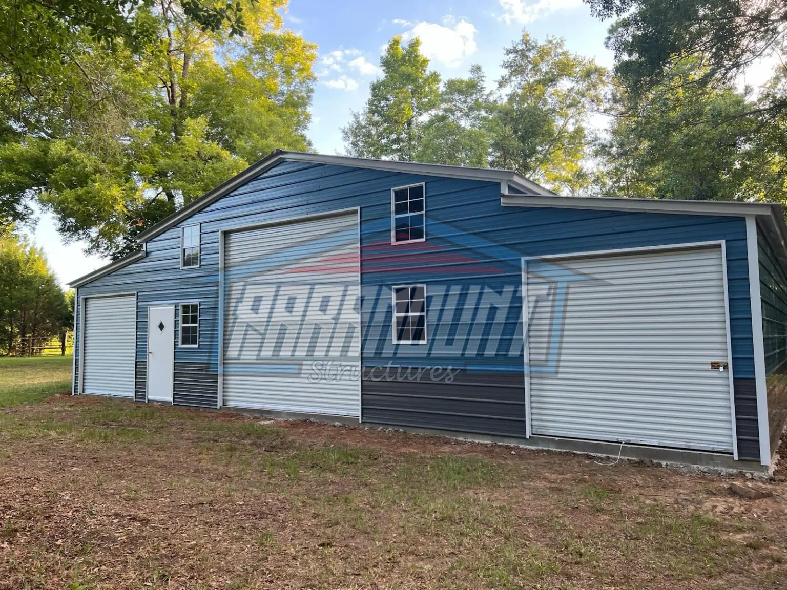 Blue and gray metal garage building.