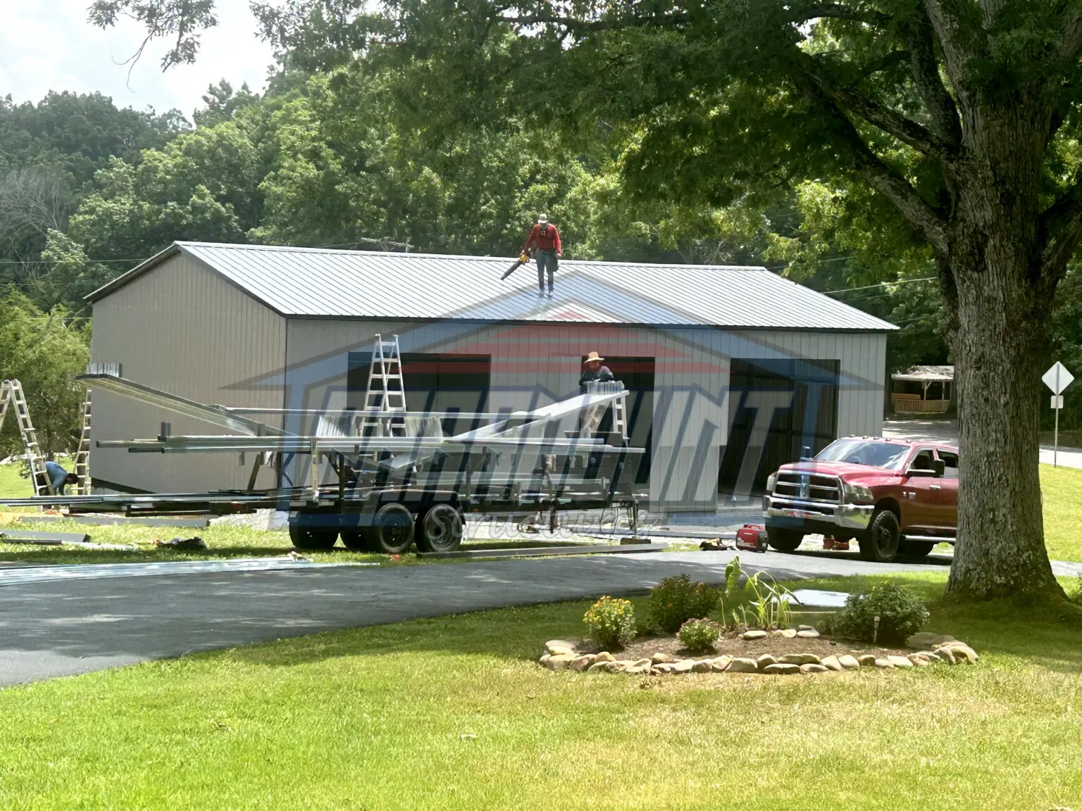 A new metal garage under construction.