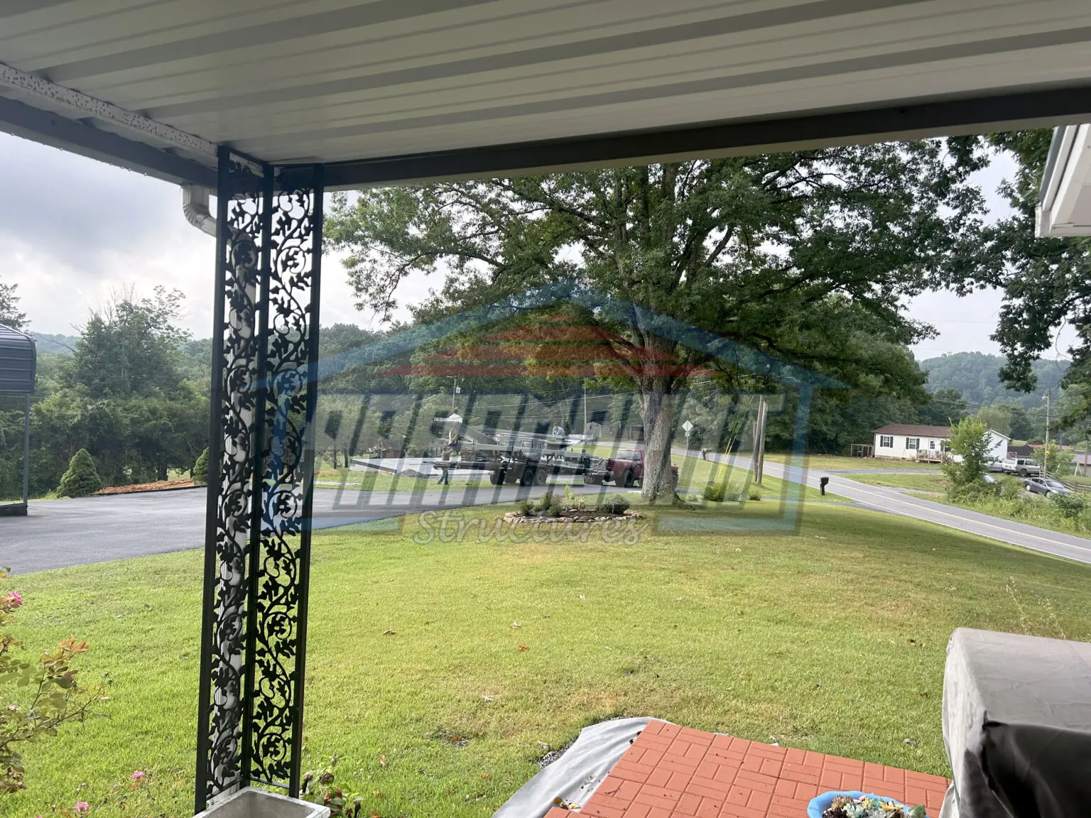 View from porch with ornate columns.