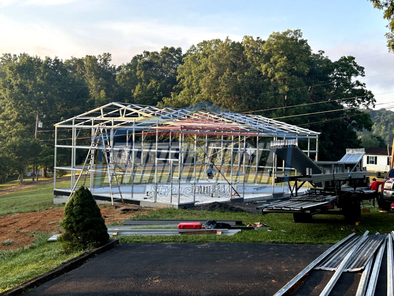 Metal frame building under construction.